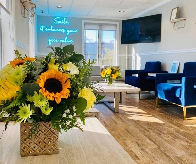 Bouquet of flowers on table in dental office reception area