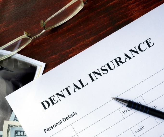 Dental insurance paperwork on desk