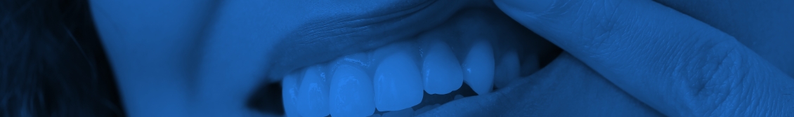 Close up of person pointing to their gums before gum disease treatment in Bayville